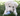 Labrador puppy in grass with blue KONG puppy toy