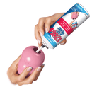 Hand squirting KONG Easy Treat into pink Puppy KONG