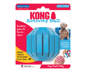 White background with a pack of one blue KONG Activity Ball for puppies, pictured on the pack is a girl holding a Labrador puppy. 