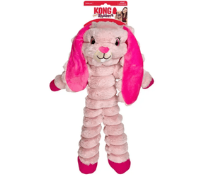 Pink soft fabric and rope rabbit KONG Dog Toy with a pink eyes, bright pink ears and feet attached to a cardboard backing, pictured on a white background. 