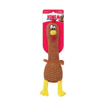 White background with a KONG Shakers Cuckoo Chicken dog toy, with a long brown neck and body, yellow beak and legs with stitched features attached to a cardboard backing.