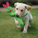 A labradour puppy running with a KONG Wubba Ballistic Friend in its mouth