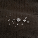 Close up of a Bolster-type black dog bed with water droplets pictured on the waterproof surface. 