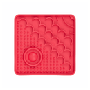 White background with a red square LickiMat Catster slow feeder mat with a scaly and bobbly surface.
