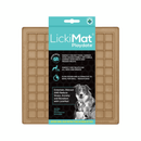 White background with a bronze LickiMat Playdate slow feeder mat with a square grid surface. The Playdate mat is in black and blue packaging cardboard packaging. 