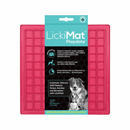 White background with a pink LickiMat Playdate slow feeder mat with a square grid surface. The Playdate mat is in black and blue packaging cardboard packaging. 