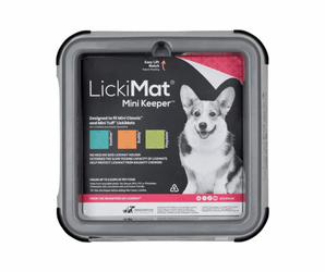 White background with a grey LickiMat Mini Keeper for slow feeding mats. The Keeper has a black sticker inside with a Corgi pictured and compatible feeding mats.  