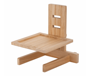 White background with a wooden LickiMat Classic Riser for LickiMats slow feeding mats. 