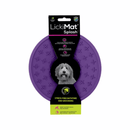 White background with a purple LickiMat Splash slow feeder with a criss-cross internal surface. The Splash bowl is in black cardboard packaging. 