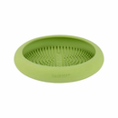 White background with a green LickiMat UFO slow feeder bowl with a bobbly internal surface.