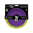 White background with a purple LickiMat Wobble slow feeder with a bobbly internal surface. The Wobble bowl is in black cardboard packaging. 