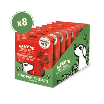 A retail display box of Lily's Kitchen Proper Treats for Dogs, featuring eight red and green individually wrapped bags of training treats with an 'x8' green badge overlay, on a white background.