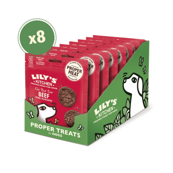 A retail display box filled with multiple packages of Lily's Kitchen Proper Treats for Dogs, beef flavor. The display box is green and red with cartoon dog illustrations, and a green circular 'x8' badge is shown in the top left corner against a white background.