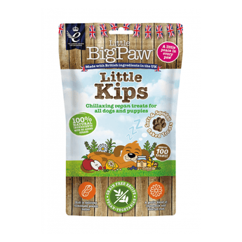 White background with a packet of Little BigPaw 'Little Kips' dog treats. Pictured on the packet is an illustration of a brown dog sleeping with a apples, berries, lemons and a jar of peanut butter in the foreground. Text on the bag says 'Chillaxing vegan treats for all dogs and puppies, 100% natural ingredients, soft & squidgy baked treats. Approx. 100 treats!' 