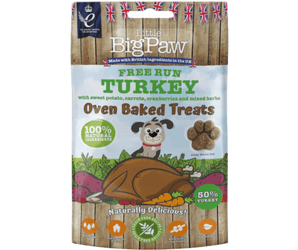 White background with a packet of Little BigPaw 'Free Run Turkey with sweet potato, carrots, cranberries and mixed herbs' dog treats. Pictured on the packet is an illustration of a grey dog with a cooked turkey and vegetables in the foreground. Text on the bag says 'Oven Baked Treats, 100% natural ingredients, Naturally delicious! 50% turkey'. 