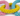 Close up of pastel pink, yellow and blue heart shaped rope dog toy.