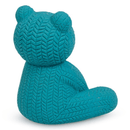 Rear view of blue latex teddy bear in a sitting position on a white background. 