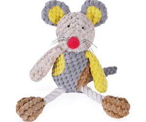 Patchwork Mouse Dog Toy with pale grey face with a red nose and stitched eye details, with string whiskers. Yellow inner ear with dark grey outer. Dark grey body with yellow and brown patches, long rope legs attached to brown feet pictured on a white background. 