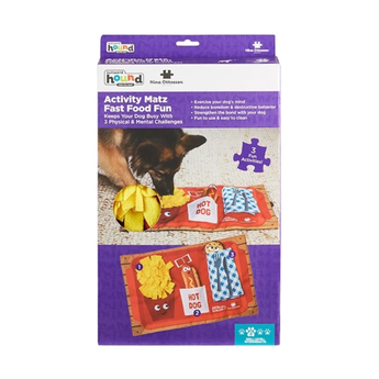 Nina Ottosson Activity Matz Fast Food Game retail packaging, showing product title, a small preview of the game board, and a  dog pictured using the mat on a white background.