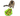 A tabby cat with white paws is interacting with a green leaf-shaped pet toy on a white background. The toy has red ladybug-shaped pieces and small orange treats scattered nearby.