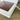 Close-up of a white electronic device with a screen on a wooden surface