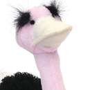 Close up of ostrich dog toy's pink head with a white beak, fluffy black eyebrows and stitched eye details, pink neck, black and white body. Pictured on a white background.