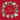 A festive Christmas greeting card design with a red background, gold 'Merry Christmas' text in the center, and a decorative wreath around the border featuring birds, a goose, swans, dancers, musical instruments, and ornaments.