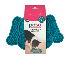 PDSA dog shaped lick mat shown in its retail packaging, with two teal silicone lick mats visible behind the pink and white box on a white background.