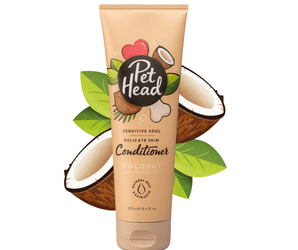 White background with a beige bottle of Pet Head Sensitive Soul conditioner for dogs. On the bottle is illustrated coconuts, leaves and a dog bone with text 'Sensitive Soul, Delicate skin, Conditioner, Coconut with Marula oil'. 