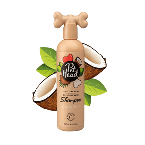 White background with a beige bottle of Pet Head Sensitive Soul shampoo for dogs. On the bottle is illustrated coconuts, leaves and a dog bone with text 'Sensitive Soul, Delicate skin, Shampoo, Coconut with Marula oil'. 