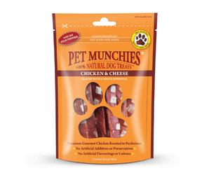 A stand-up pouch of Pet Munchies Chicken with Cheese dog treats on a plain white background. The packaging is bright orange with a large paw-shaped window showing the chicken with cheese treats inside.