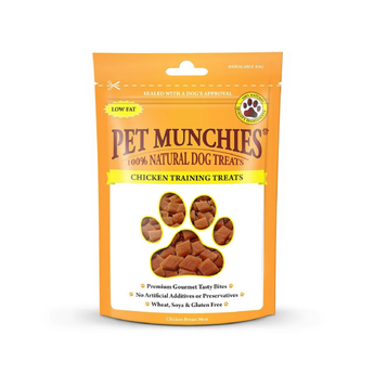 A stand-up pouch of Pet Munchies Chicken training dog treats on a plain white background. The packaging is bright orange with a large paw-shaped window showing the chicken training treats inside.