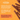 Promotional graphic for Pet Munchies Natural Pet Treats featuring several dog chews on a bright orange background with product text and paw-print motifs.