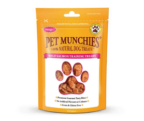 A stand-up pouch of Pet Munchies Salmon training dog treats on a plain white background. The packaging is bright orange with a large paw-shaped window showing the salmon training treats inside.
