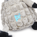 Close up of grey donkey dog toy with back tail and hoofs wearing a blue neckerchief, focus on stitch detail of 'PF' on back sat on a white background. 