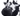 Close up of black and white cow dog toy's face with twisted rope for legs and a micro fibre black body on a white background. 
