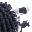 Rear close up of cow dog toy with micro fibre black body with black and white tail on a white background. 