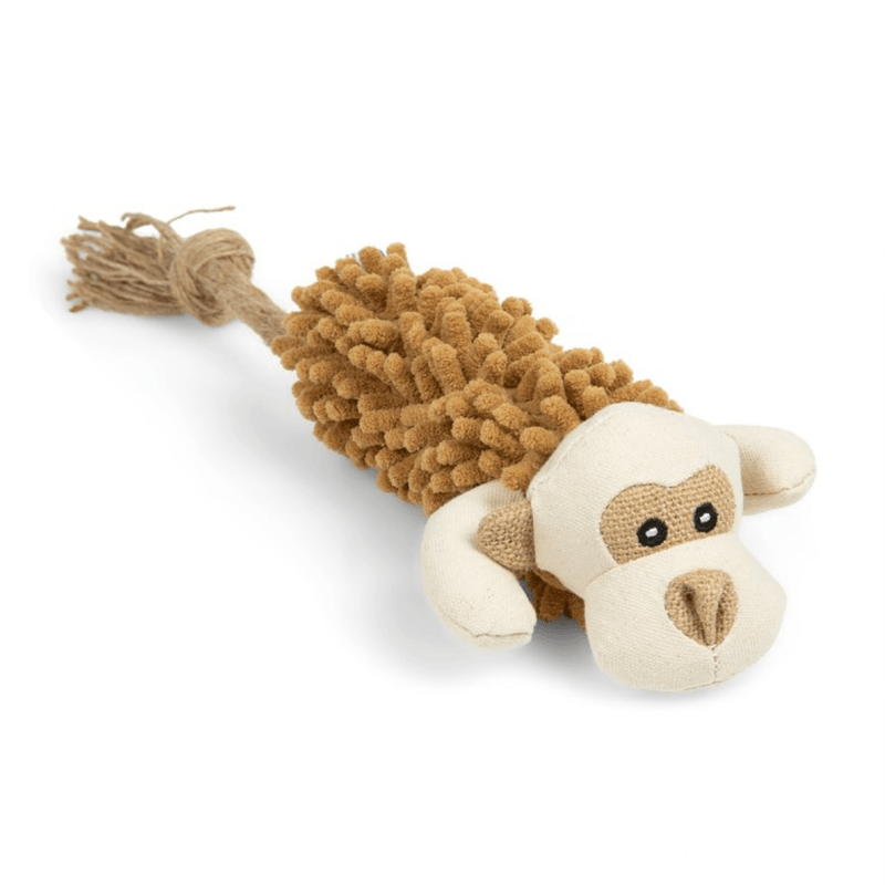 Side view of monkey dog toy with a cream fabric face with brown canvas material ascents around the eyes, nose and for the arms. Brown micro-fibre body with a rope tail on a white background. 