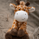 Giraffe dog toy in grass