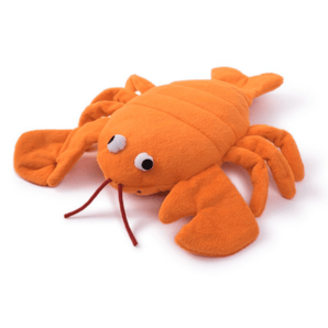 Orange plush dog toy on a white background.