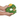 White background with a hand holding a plush dog toy Christmas wreath with a plush star with stitched eyes and smile. The toy is split open to show the rubber internal. 