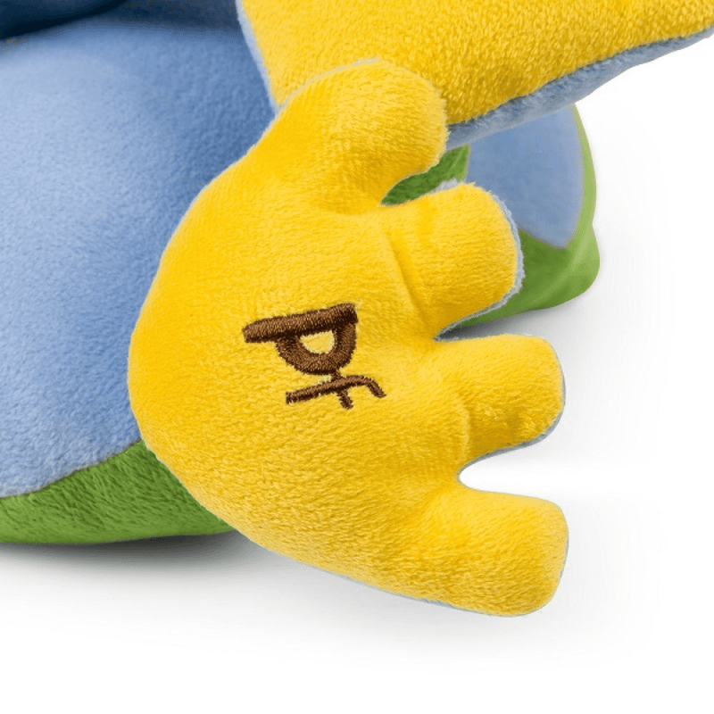 Close up of green frog plush dog toy's yellow foot with stitch detail of text 'PF'.