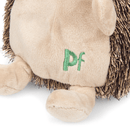 Hedgehog dog toy with a cream belly, face, legs and ears and brown spikey effect soft fabric for spines. Close up on Stitch detail in green of 'PF' on the belly. Sat on a white background. 