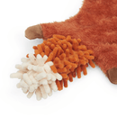 Close up of squirrel dog toy's tail made out of orange microfibre with a white tip on a white background. 