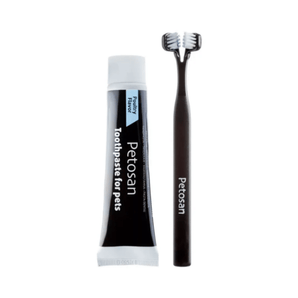 White background with a black doubled headed toothbrushes for dogs pictured next to a tube of Petosan Toothpaste for pets. 