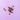 A small pile of brown tooth-shaped pet treats scattered on a lavender purple tiled background.