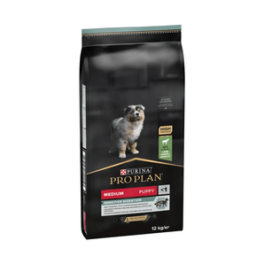 White background with a black bag of Purina Pro Plan Medium Puppy Sensitive Digestion. Pictured on the bag is an collie puppy. 