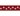 White background with close up of a red 'Red Dingo' dog collar with white stars along the length. 