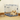 Cream coloured Pomeranian dog lying in a Rosewood Options dog crate in a corner of a room with a bowl next to it.