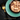Black background with a teal bowl of Sheba Chicken, Shrimp and Ocean Fish Filets wet food in gravy pictured.